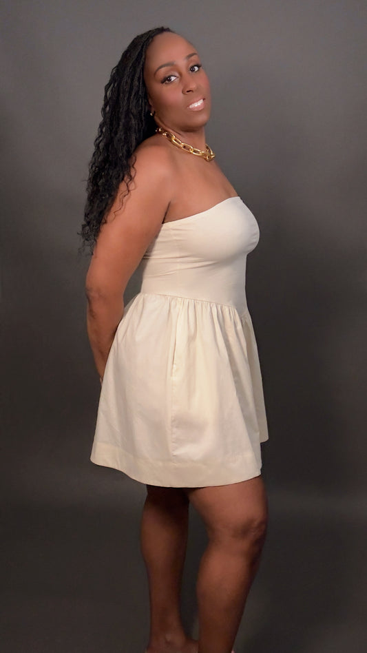 Side view of the Tara Dress in cream from Wellington Hill, featuring a strapless tube cut, flattering fit, and minimalist spring fashion design.