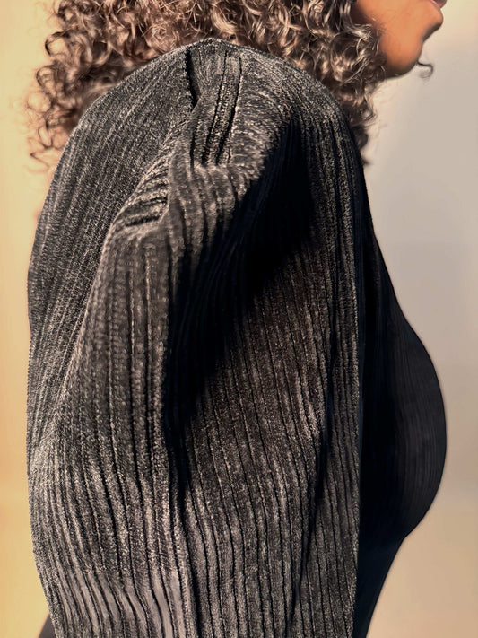 Detail view of women's elevated casual long sleeve black corduroy velvet mini dress, highlighting its puff sleeves, luxurious texture and fine craftsmanship for a stylish finish perfect for going out outfits or a winter party.