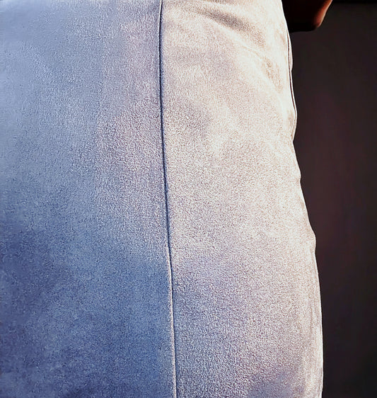 Close-up of fitted gray Women's Elevated Casual faux suede mini skirt with slit, showcasing the soft texture and stylish design perfect for elevated casual outfits.