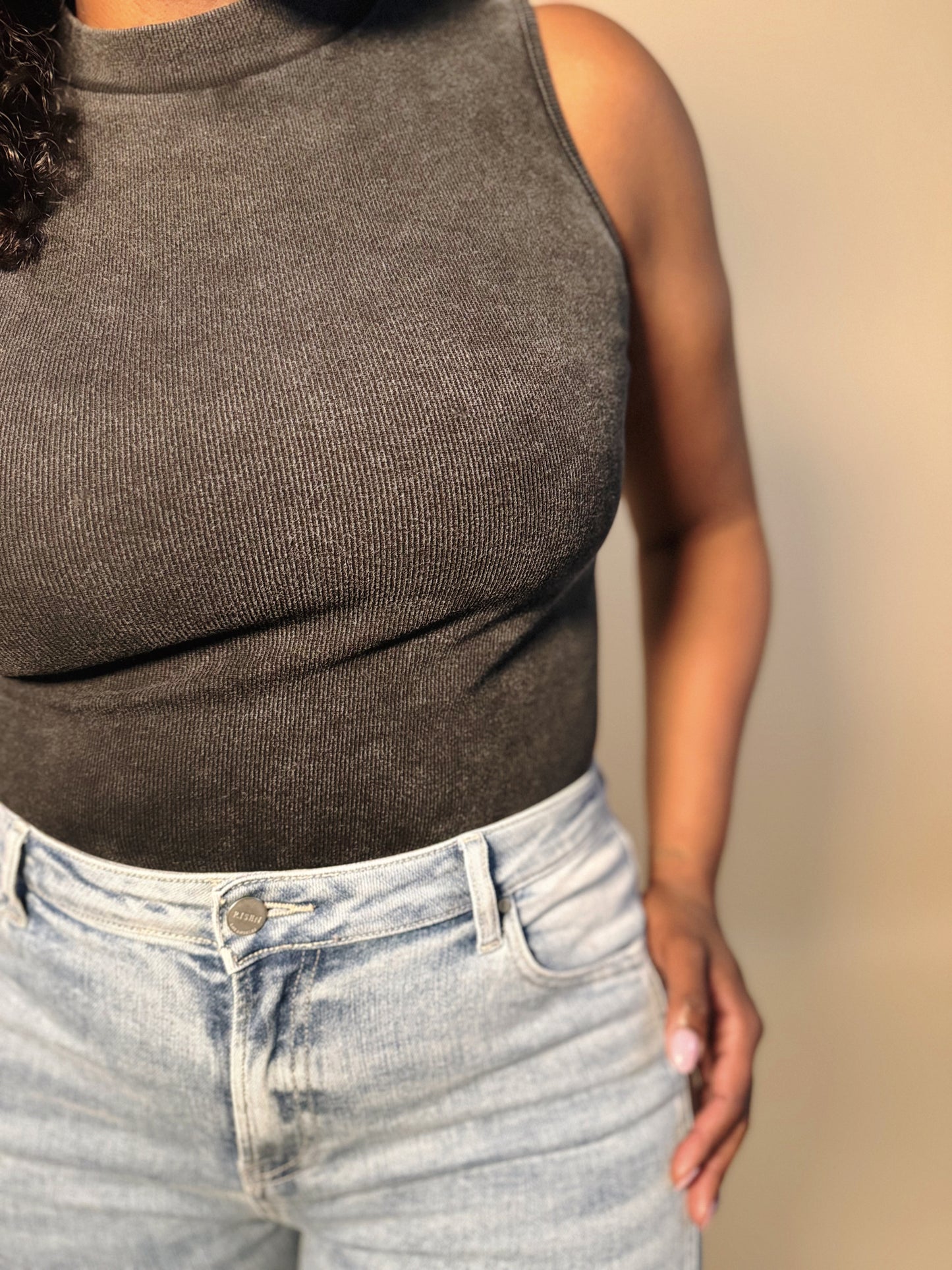 Front detail view of Women's Elevated Casual Mineral Washed Mock Neck Bodysuit top, showcasing its textured fabric, mock neck design, and stylish fit.