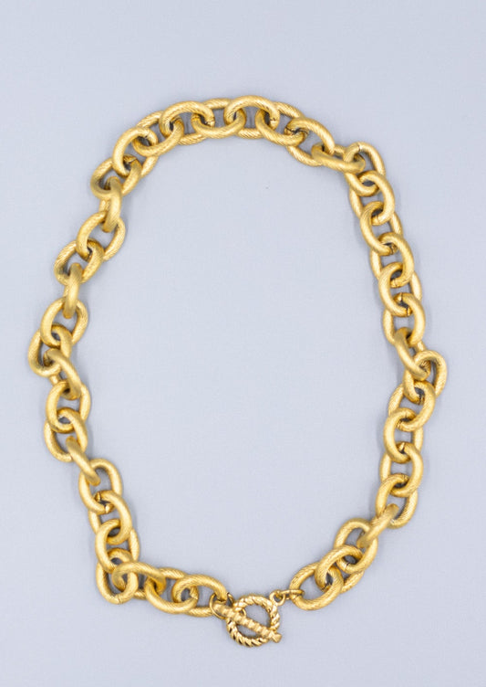 18k gold plated textured link chain necklace on a light gray background