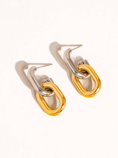 Pair of earrings with yellow and white gold hoop chain links on a white background