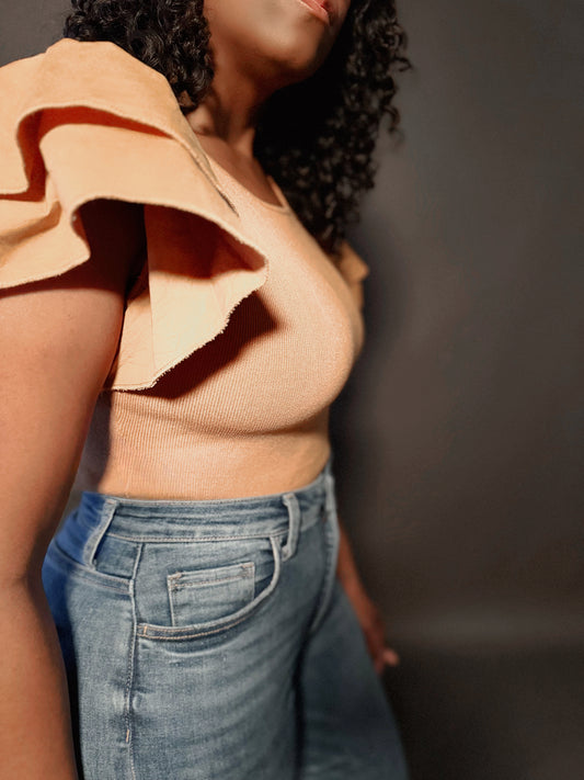 Side detail view of Womans Elevated Casual Ruffle Sleeve Sweater Bodysuit top, highlighting the elegant ruffle sleeve design and soft, textured knit fabric.