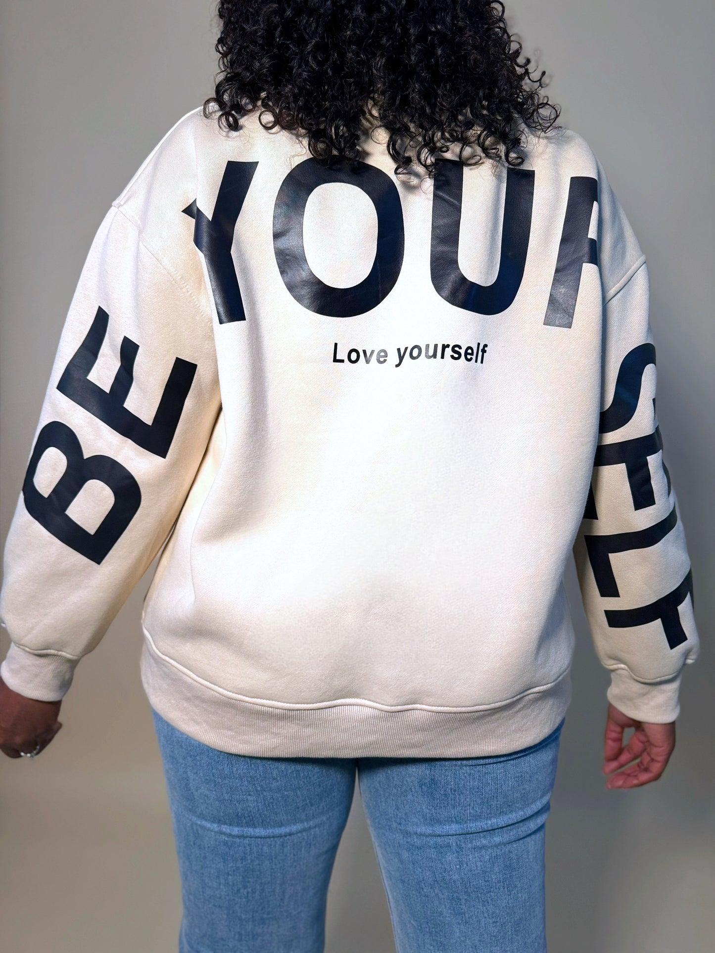 Front view of Women's Elevated Casual 'Be Yourself' oversized sweatshirt, featuring a bold graphic print, relaxed fit, and soft, cozy fabric for casual comfort.