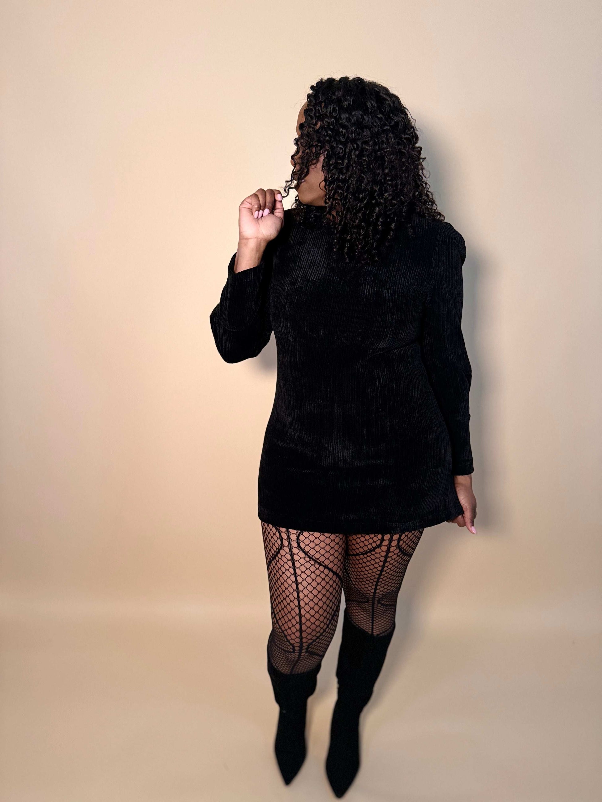 Front view of women's elevated casual long sleeve corduroy velvet mini dress in black, showcasing its rich texture and sleek, modern design for a chic look.